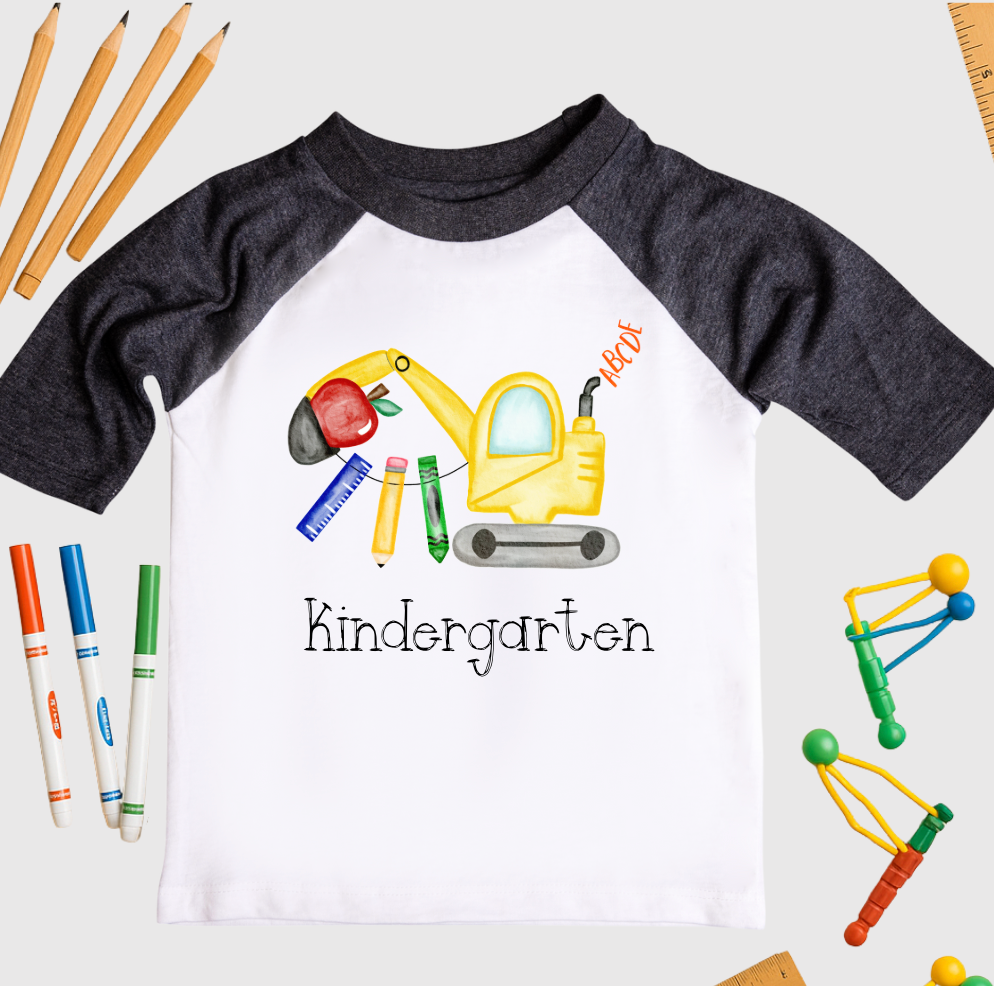 Children's t-shirt with 'Kindergarten' design on a white background with educational items.